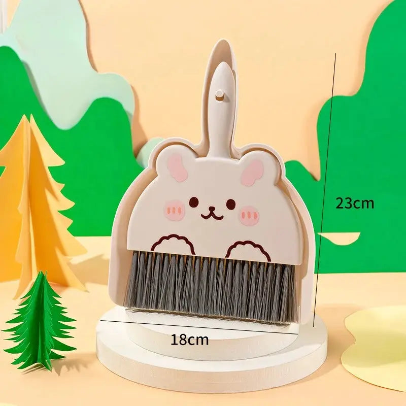 Mini Cartoon Desktop Cleaning Broom by Simples Market, bunny-face design with white body and gray bristles.