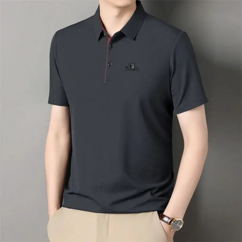 Men's dark charcoal polo shirt with badge, short sleeves, breathable fabric