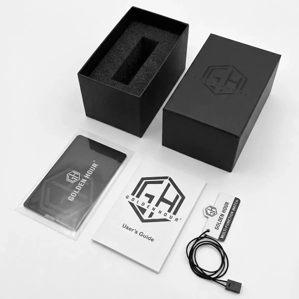 Men's GoldenHour watch packaging set: black box, foam insert, user guide, and hanging tag.