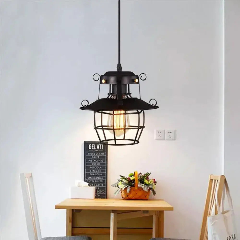 Industrial black metal pendant chandelier with cage shade and Edison bulb for dining room or bar areas
