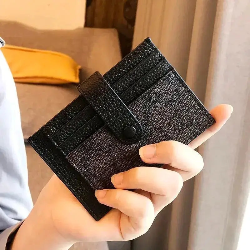 Card holder Simples Market; black textured leather wallet with multiple card slots and snap strap