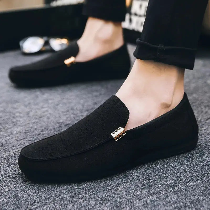 Men's black canvas slip-on loafers with gold-tone hardware