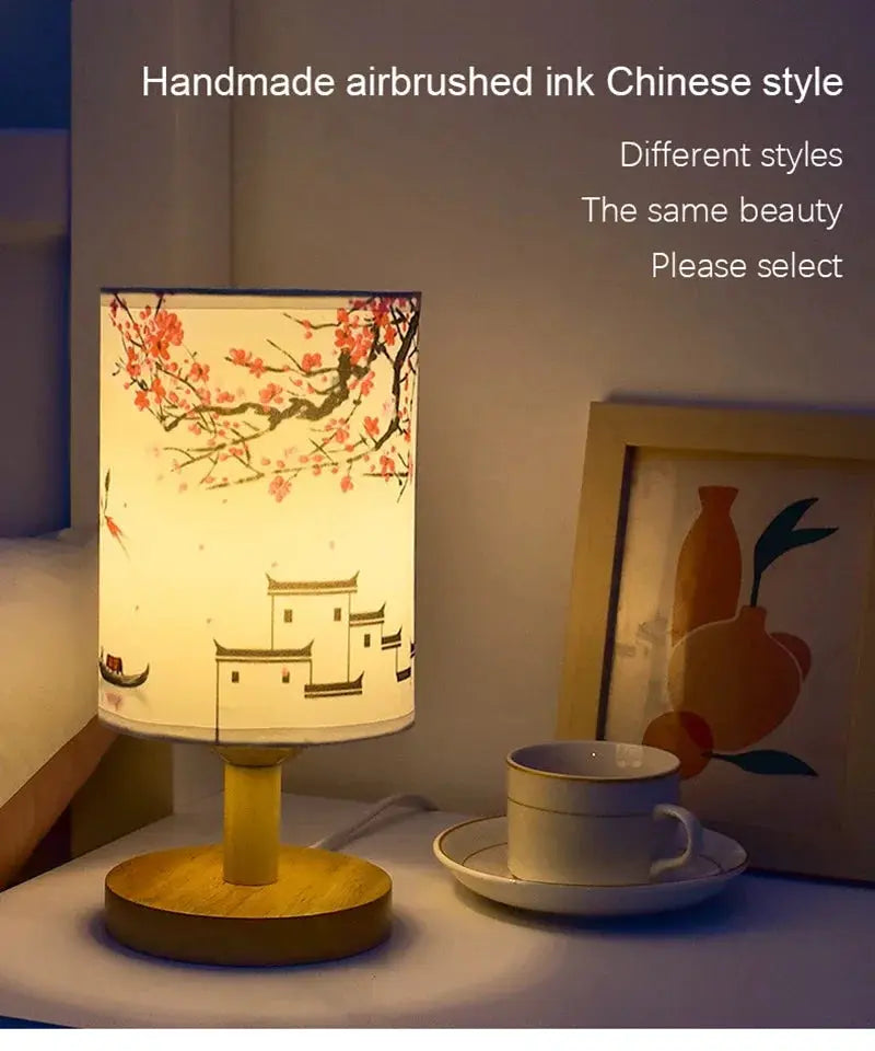 LED table lamp with fabric shade featuring plum blossom design and a wooden base