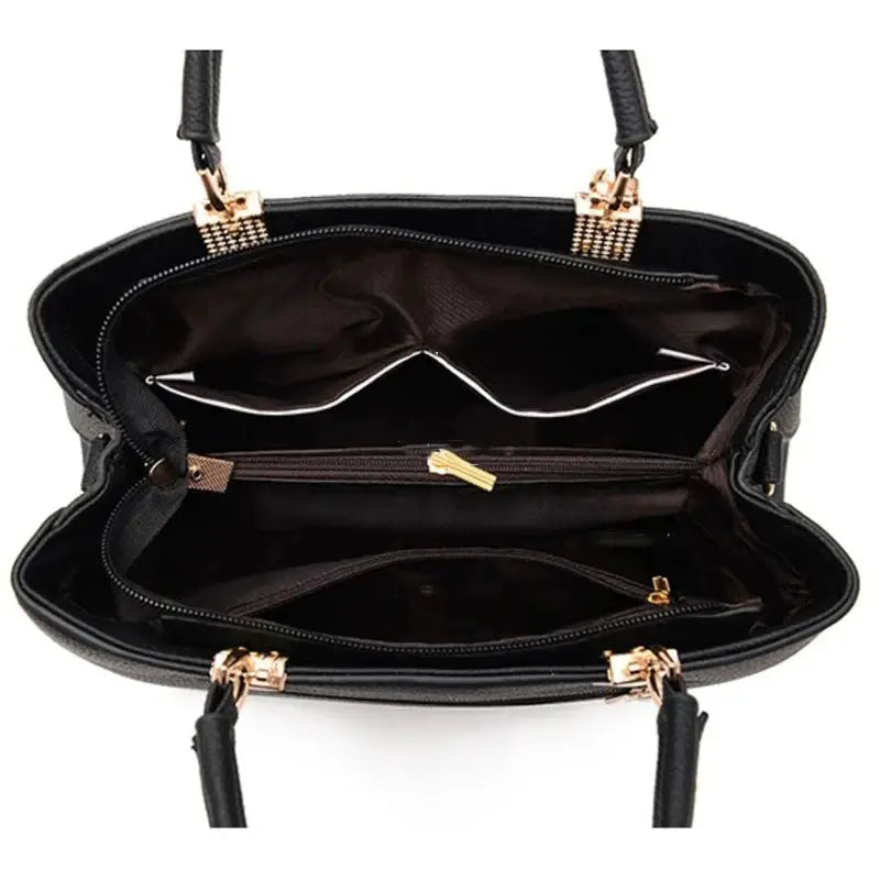 Simples Market crossbody handbag, black faux leather with floral design, gold-tone hardware, multiple compartments.