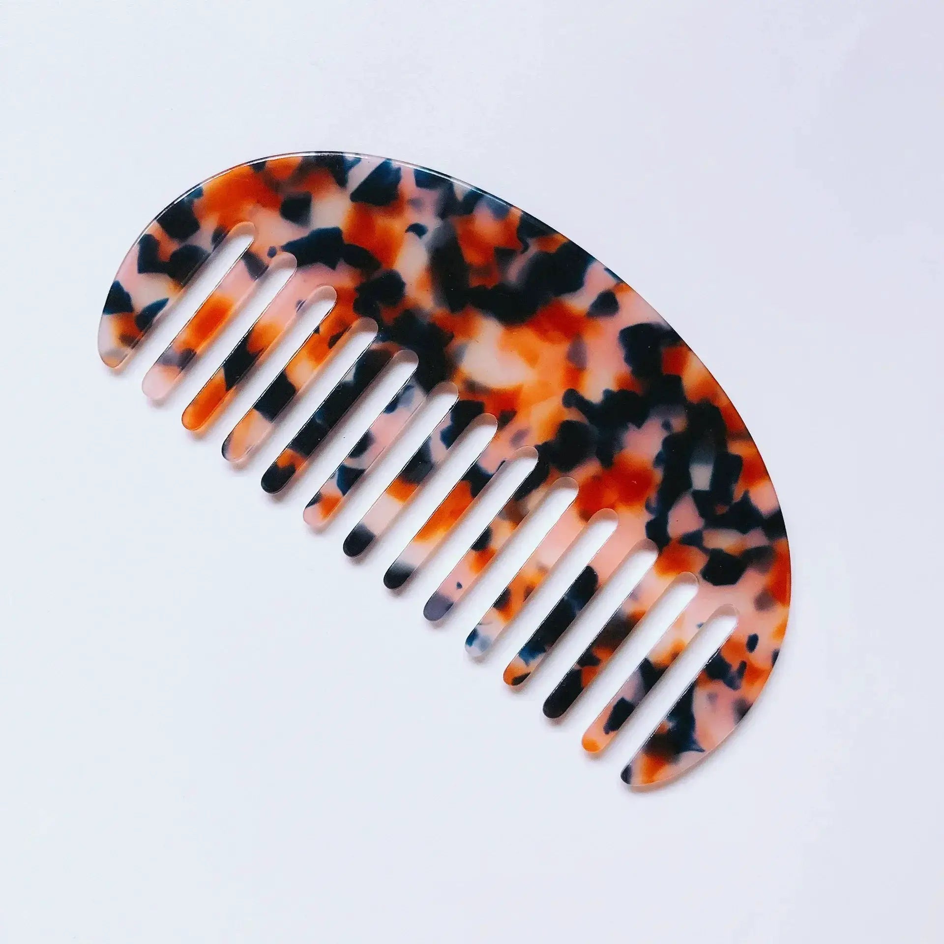 Wide-teeth acetate hair combs in tortoiseshell pattern; colorful, anti-static styling accessory