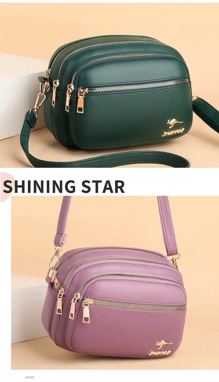 Leather purses from Simples Market, two in green and lavender with multiple zip pockets.