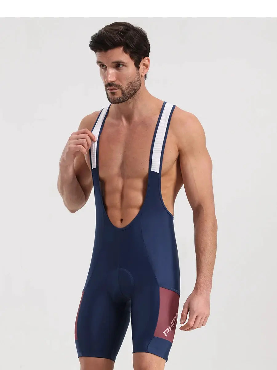 PHMAX men's cycling bib shorts in navy with white shoulder straps and pink side panels; PHMAX logo visible.