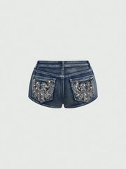 Low-rise denim shorts by Simples Market with silver-embroidered back pockets in blue denim