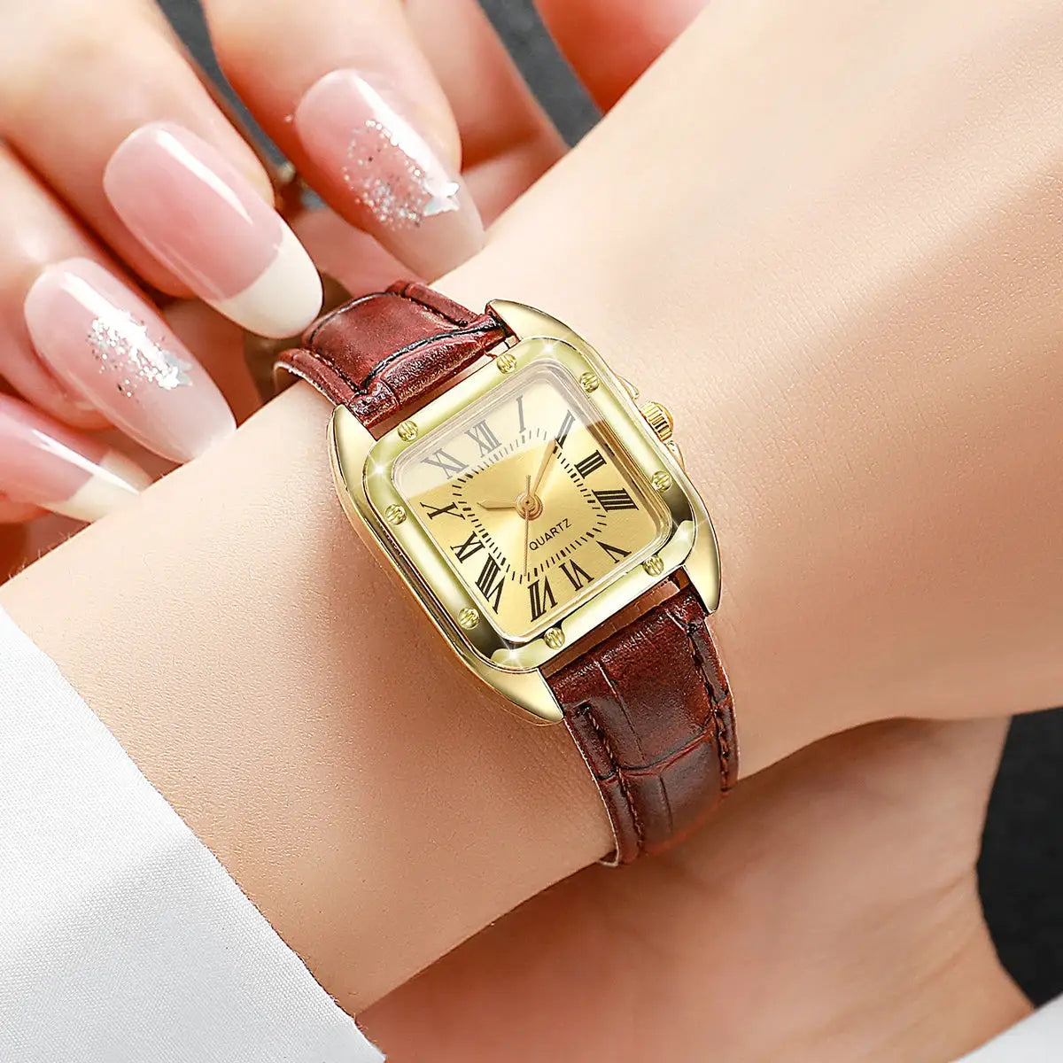 Simples Market women's square watch with brown leather strap, gold-tone case, Roman numeral dial.
