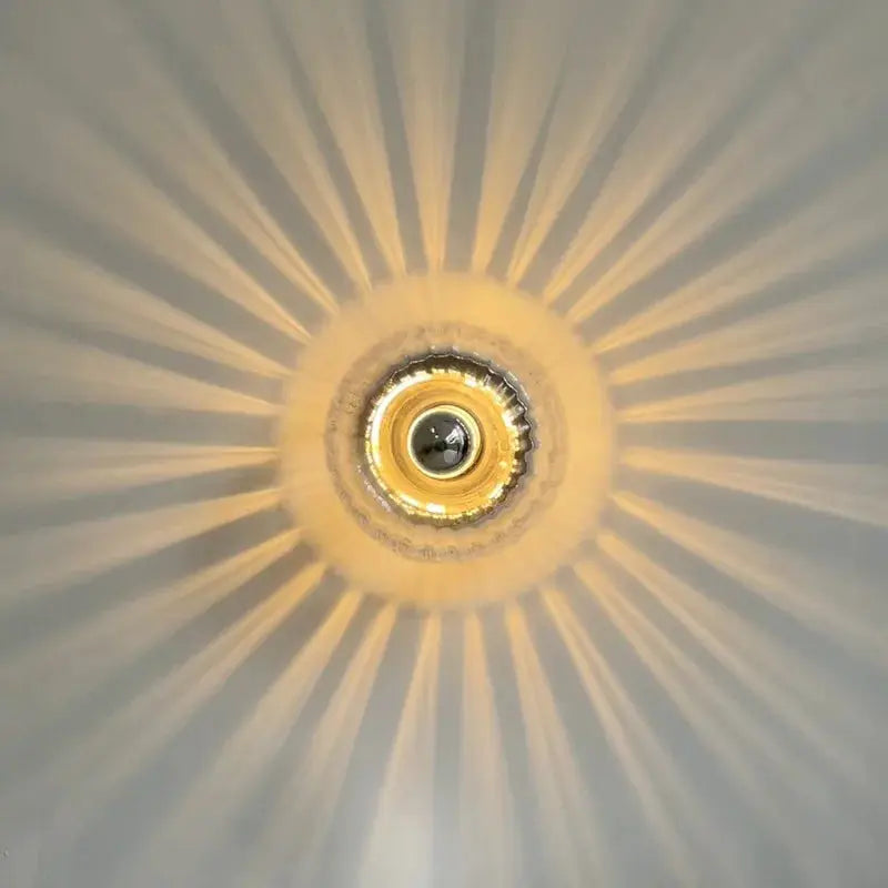 LED Bauhaus Glass Wall Lamp by Simples Market, warm amber glow with circular glass shade and gold-tone ring