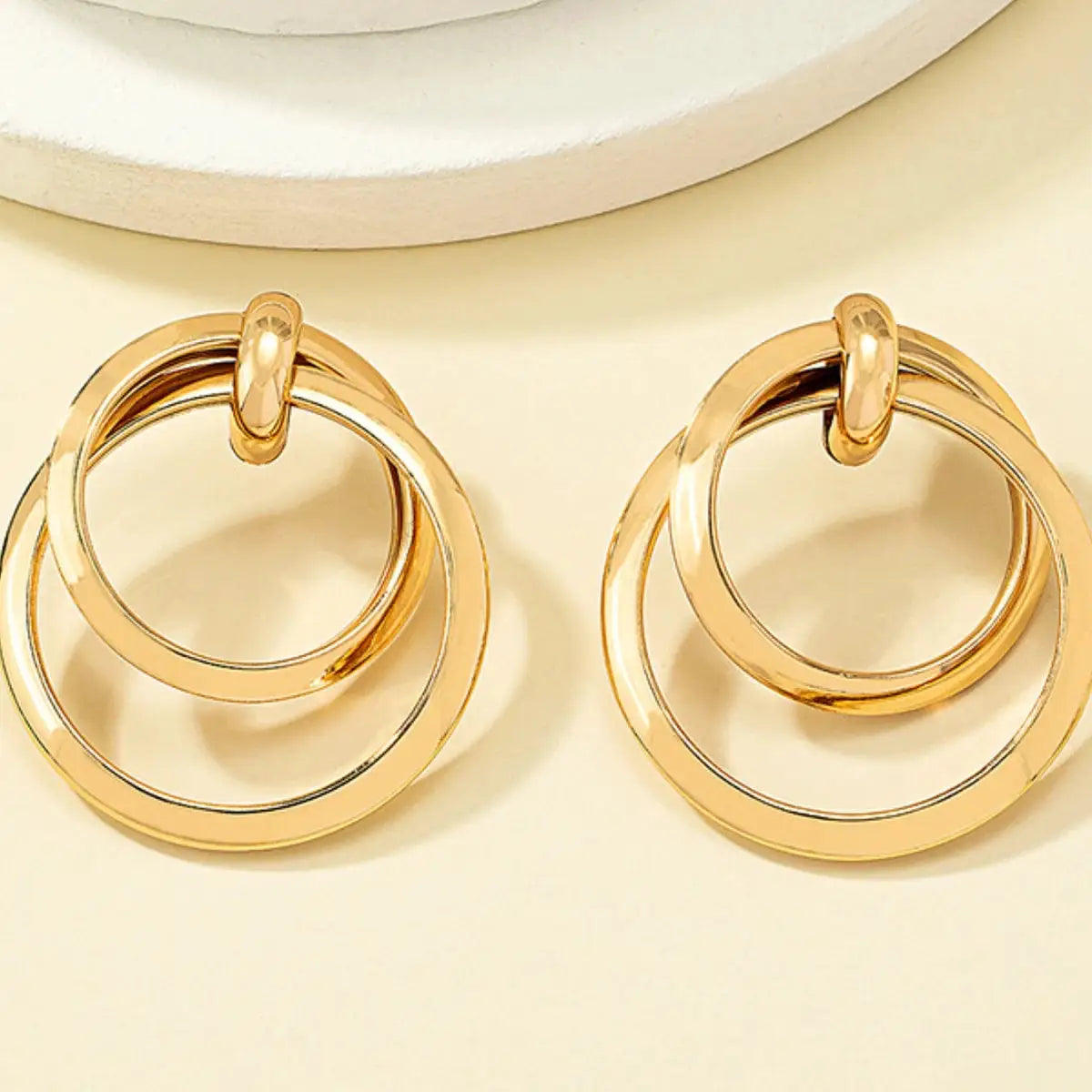 Two-piece gold-tone geometric hoop earrings set for women, zinc alloy jewelry.
