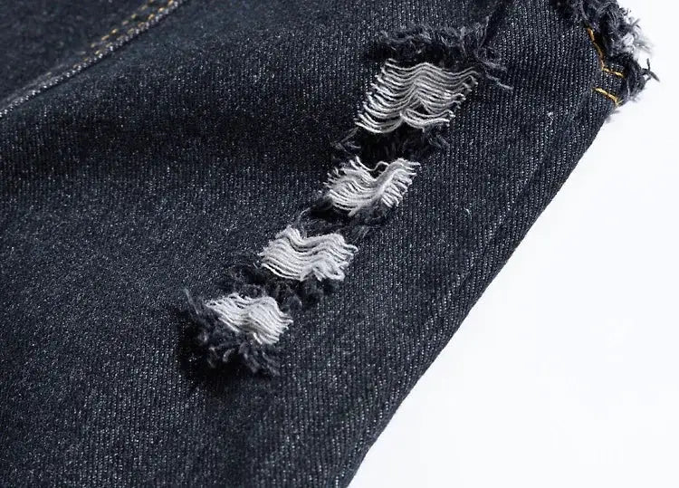 Denim jeans vest blue distressed fabric close-up; Simples Market
