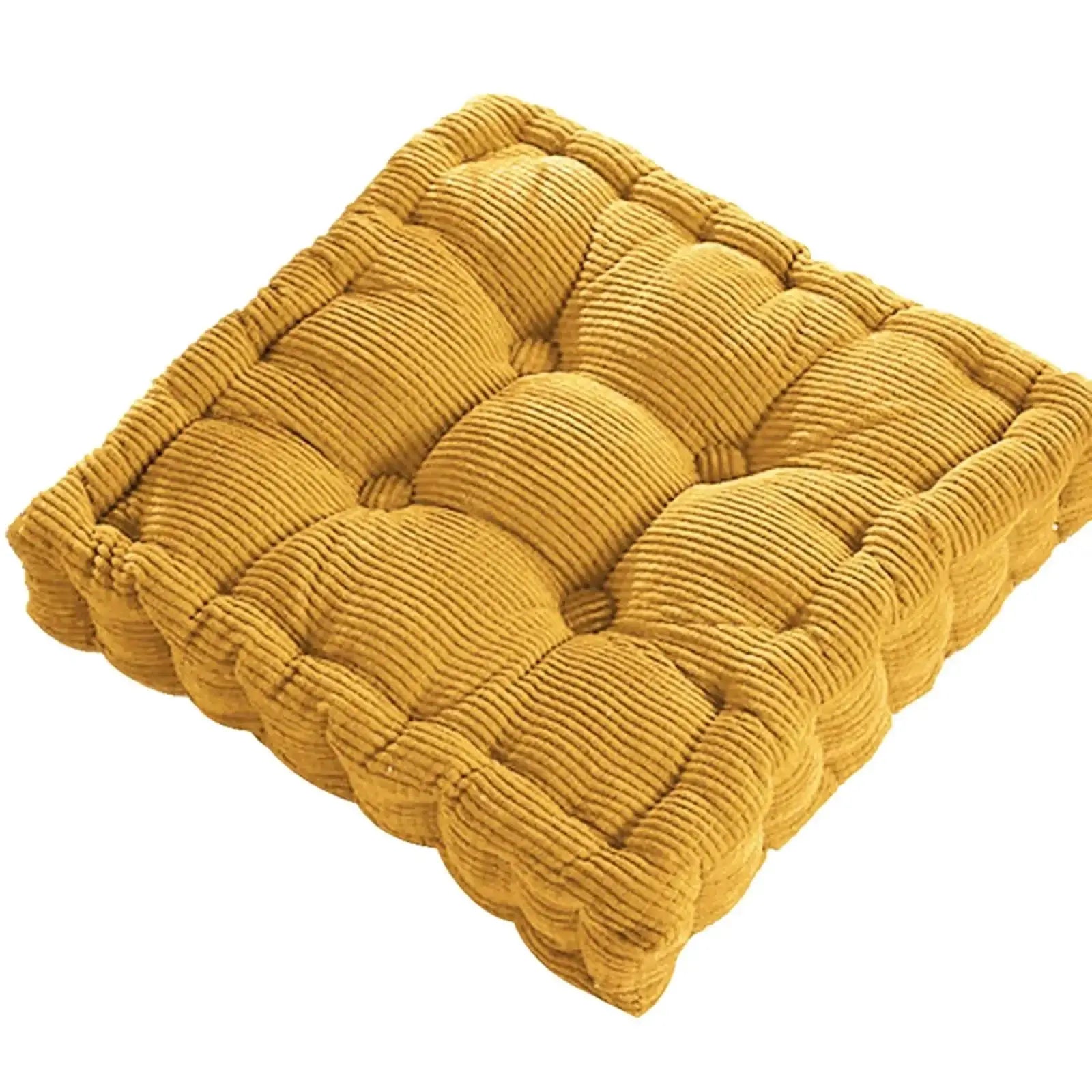 Thick square cord cushion in mustard yellow from Simples Market; tufted textile knee pillow
