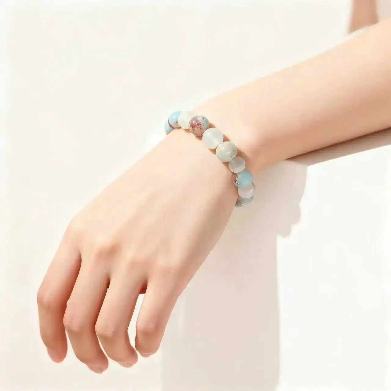 Halo Quartz Ocean Sediment beaded bracelet on wrist; unisex, pale blue and cream Shoushan stone beads, Simples Market