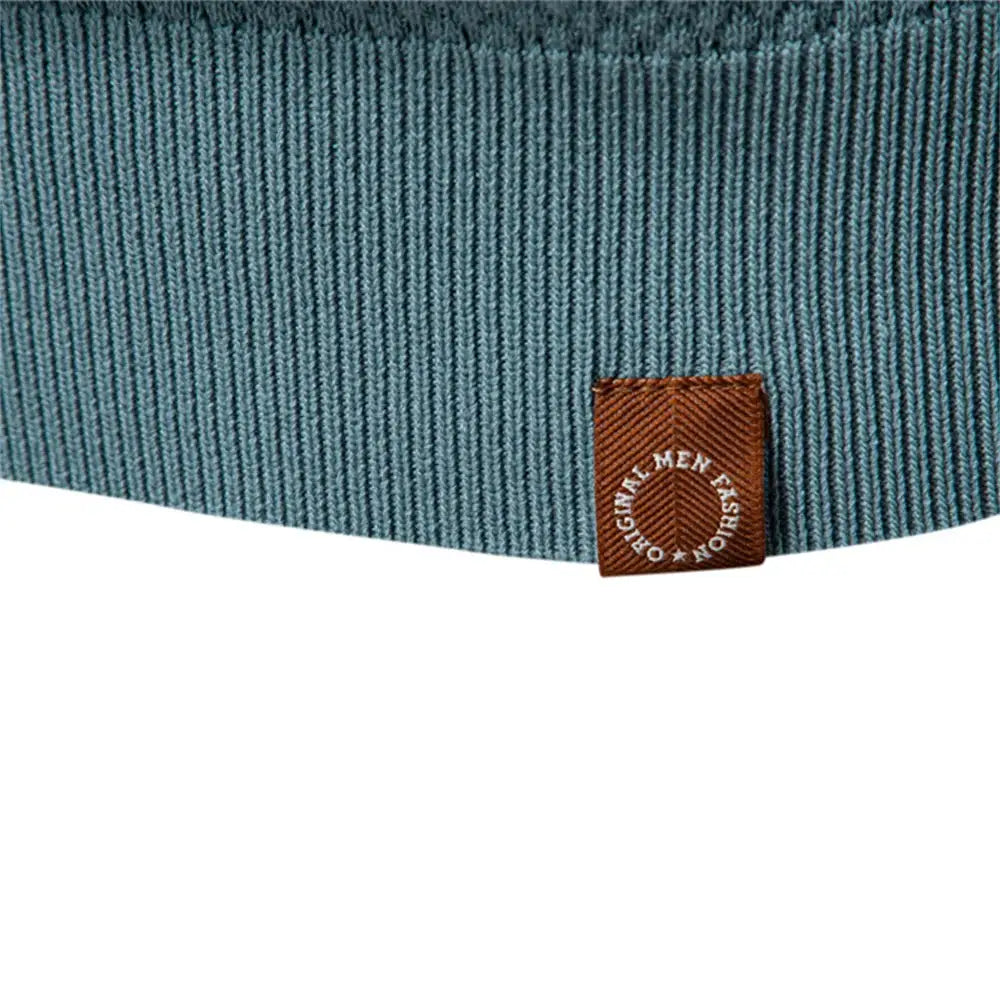 Men's polo shirt in blue ribbed fabric with a brown woven label.