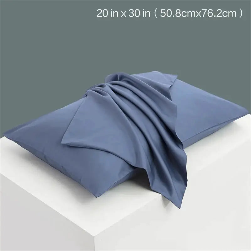 Blue solid color pillow cover, 20x30 inches, on white surface