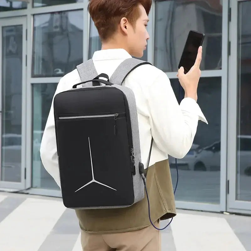 Anti-theft USB waterproof laptop backpack by Simples Market; black front panel, gray sides