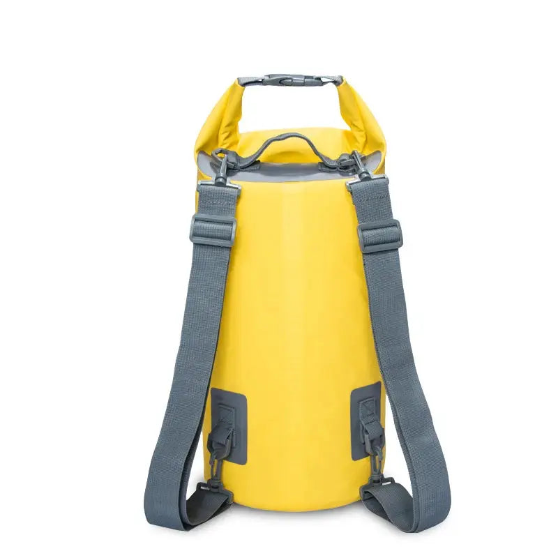 PVC waterproof dry bag backpack in bright yellow, cylindrical outdoor bag with gray twin shoulder straps and top handles