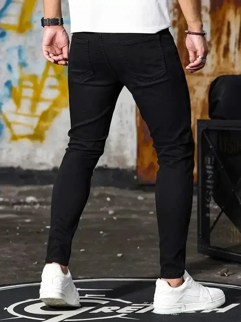 Mens slim-fit jeans, black denim, pencil leg, casual street style