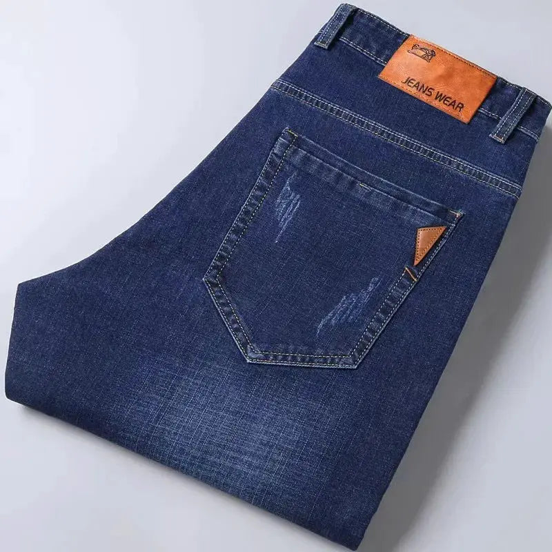 Men's dark blue denim jeans, stretch slim fit with back pocket detail and Jeans Wear patch