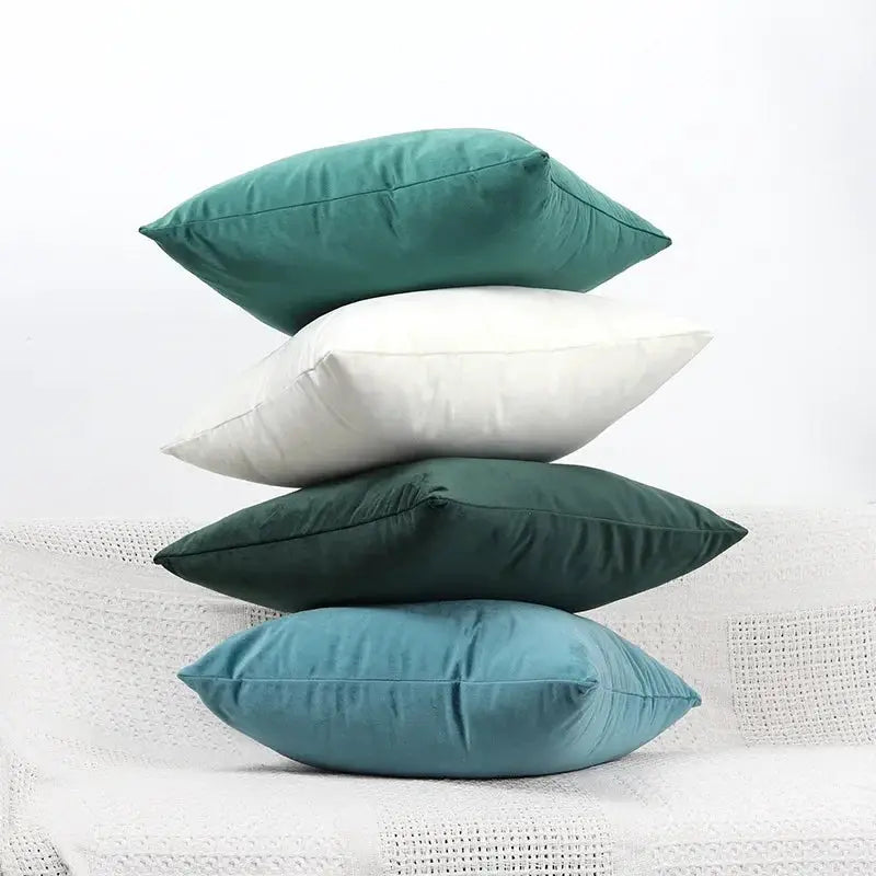 Velvet cushion covers 45x45 cm; four colors stacked in teal, white, dark green, and blue by Simples Market