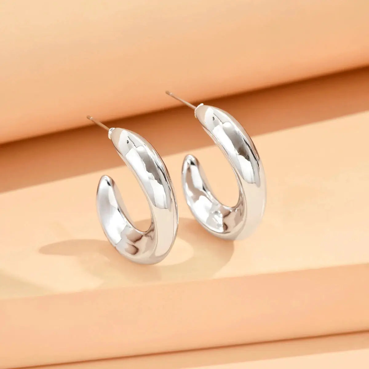 Geometric irregular hoop earrings for women, silver-tone metal, minimalist pair