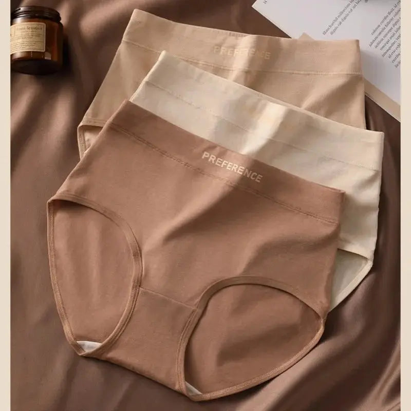 Three nude-toned high-waist cotton briefs for women; tummy-control and soft breathable underwear.