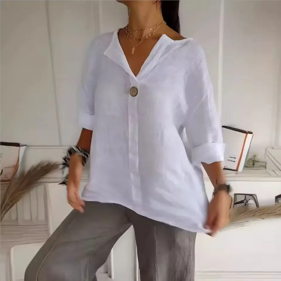Women's white linen-cotton top with V-neck, single front button, and 3/4 sleeves.