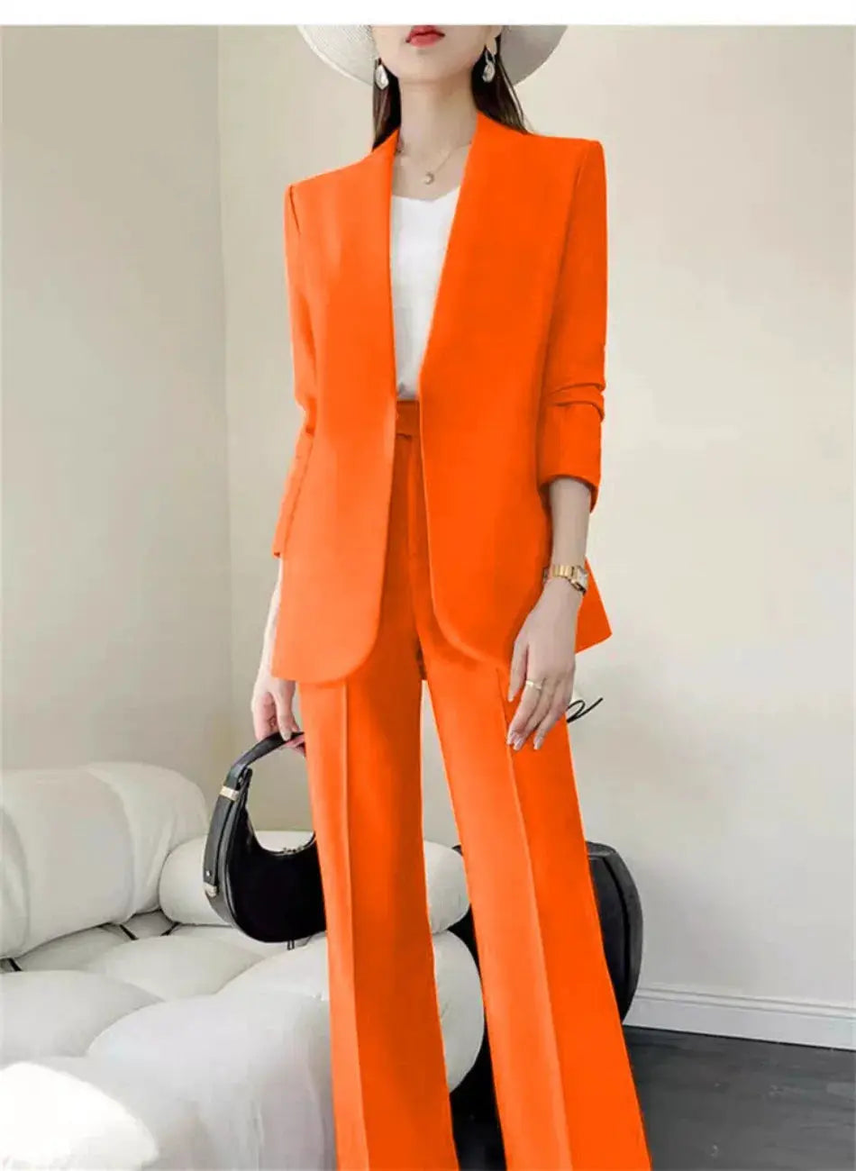 Orange 2-piece women's pantsuit with blazer and wide-leg trousers, white top, and black handbag.