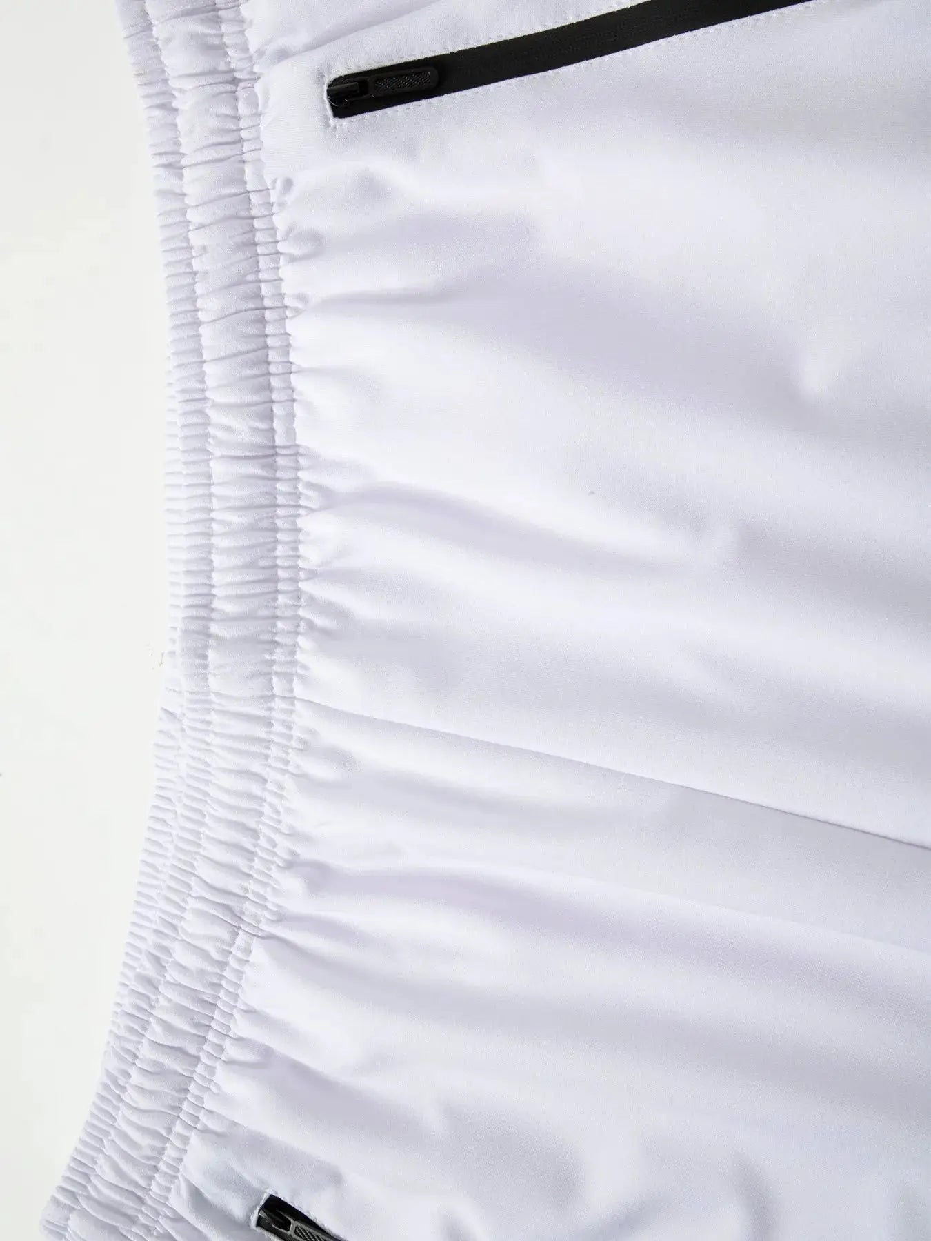 Men's white Simples Market workout shorts with zippered pocket and elastic waistband