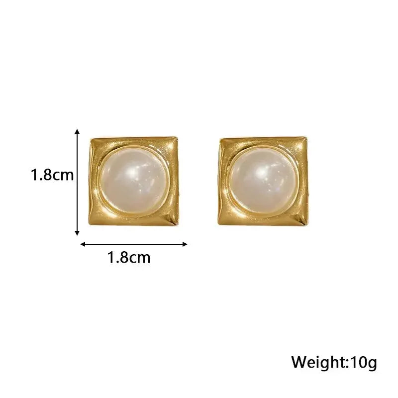 Gold square stud earrings with white faux pearl centers, pair