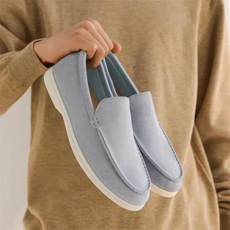 Pair of Simples Market men's suede loafers in light blue, slip-on driving flats with white sole