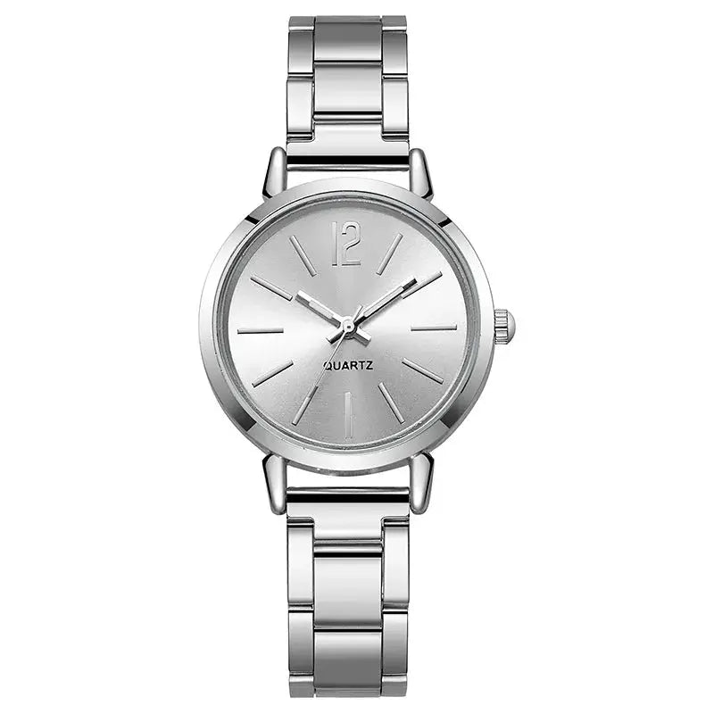 Women's silver-tone quartz wristwatch with stainless steel bracelet and minimalist dial.