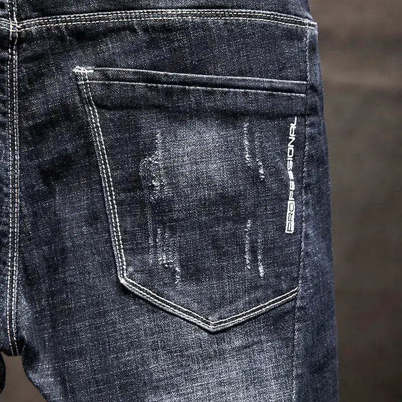American elastic straight jeans for men, blue-black denim with ripped distress and back pocket, Simples Market.