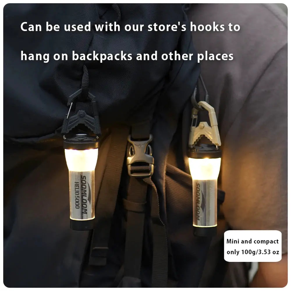 Soomloom Helio 5000 camping lanterns (2) clipped to a backpack strap; compact 100g each, USB-C