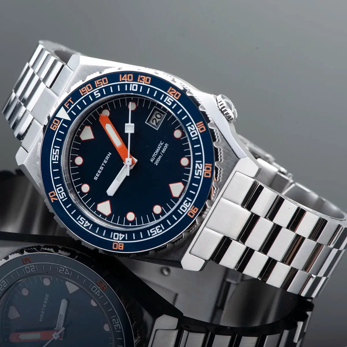 SEESTERN SUB600T diver watch; blue dial, orange accents, white markers, blue bezel, stainless steel bracelet.