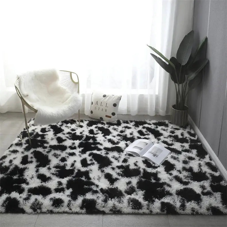 Premium fluffy area rug in black and white cow pattern, ultra-soft shag for living room
