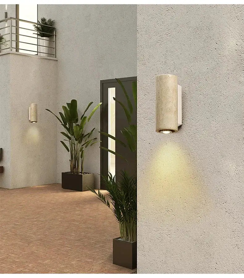 Two Wabi Sabi yellow marble LED wall lamps in travertine finish, courtyard wall lights with warm downlight