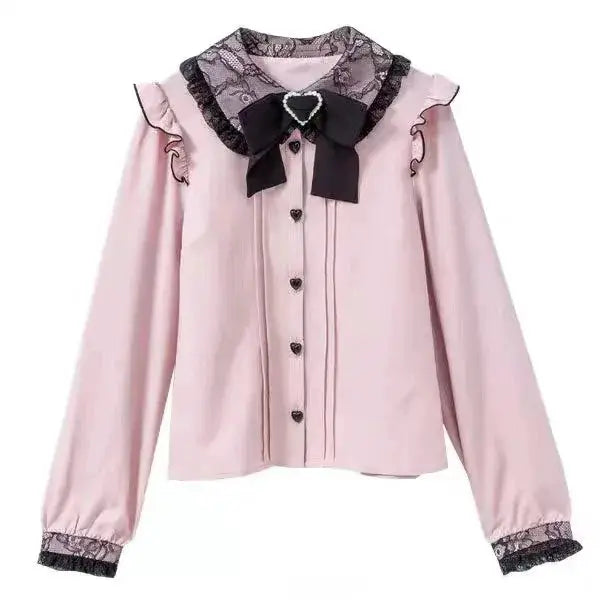 Gothic Lolita blouse in pink by Simples Market with black lace collar, bow, and heart buttons