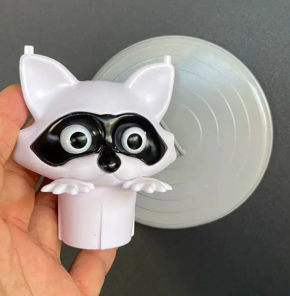 Toilet paper holder featuring a white raccoon-dog cartoon figure, Simples Market