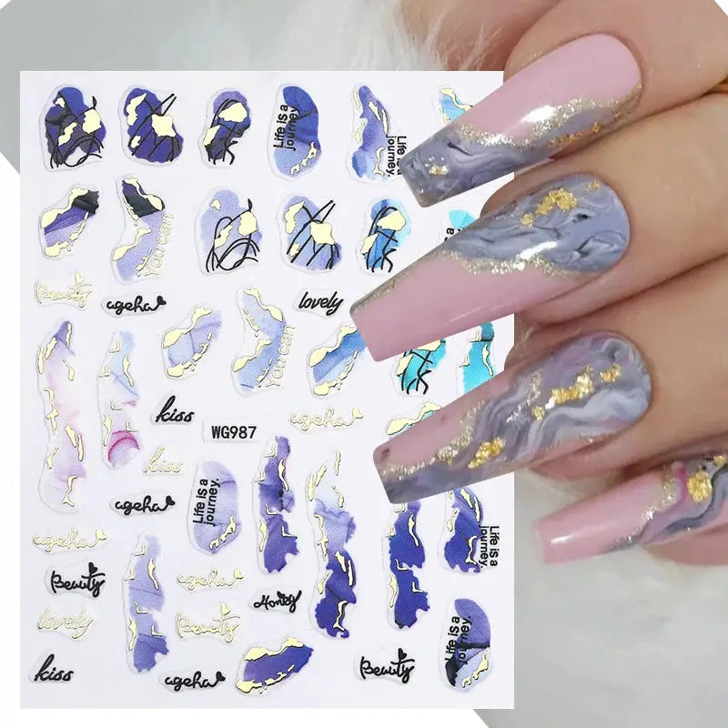 Nail art decals sheet by Simples Market with colorful purple/blue marble designs and gold foil accents