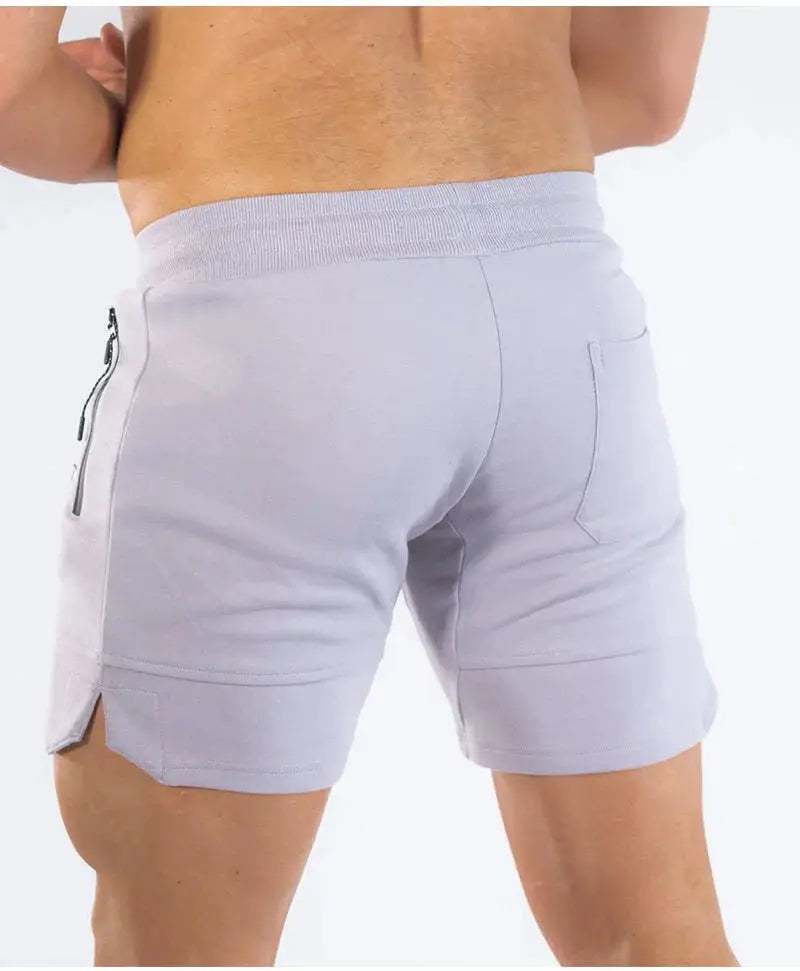 Men's light gray zip-pocket sweat shorts with elastic waistband and back pocket.