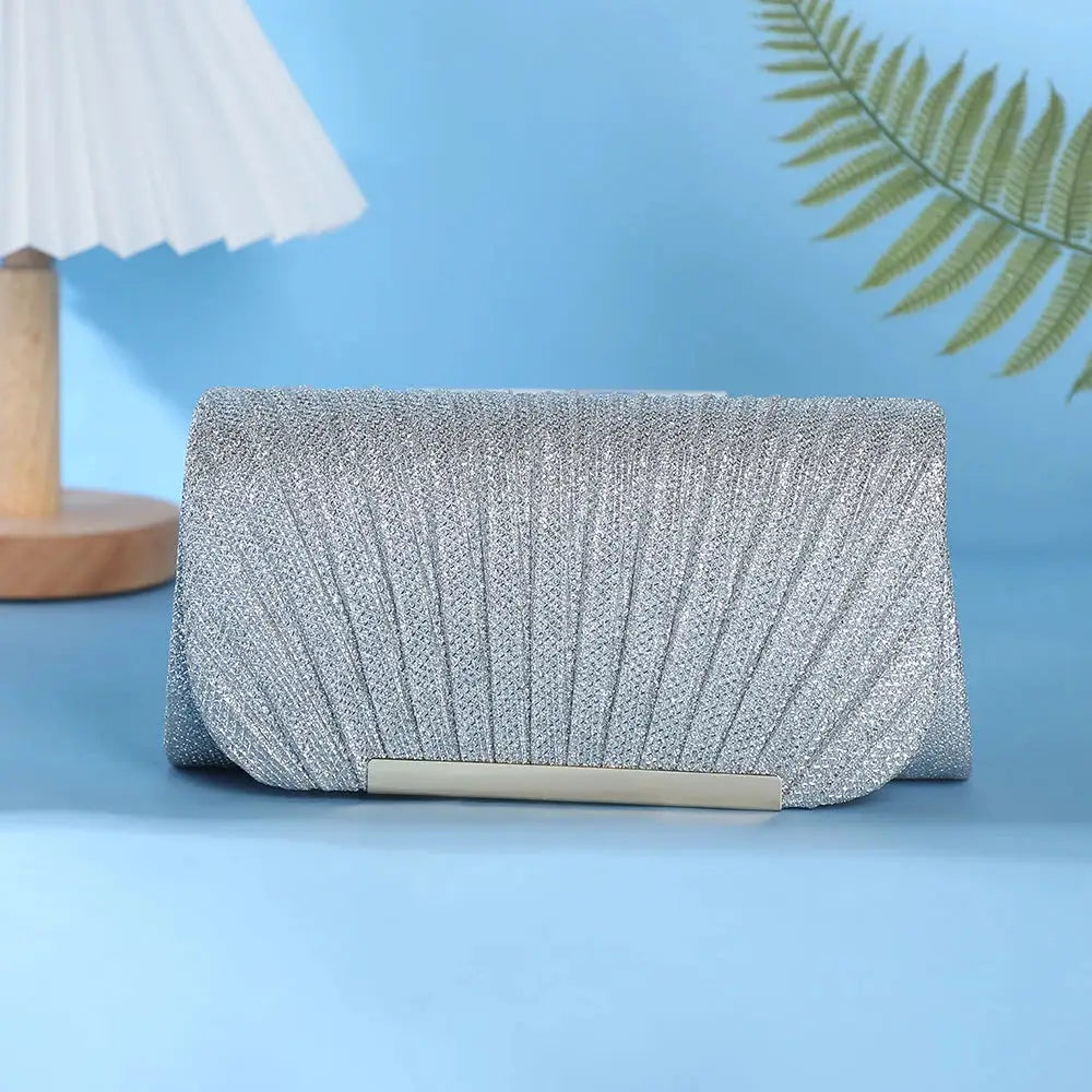 Evening clutch bag by Simples Market, silver sequined with metal bar clasp