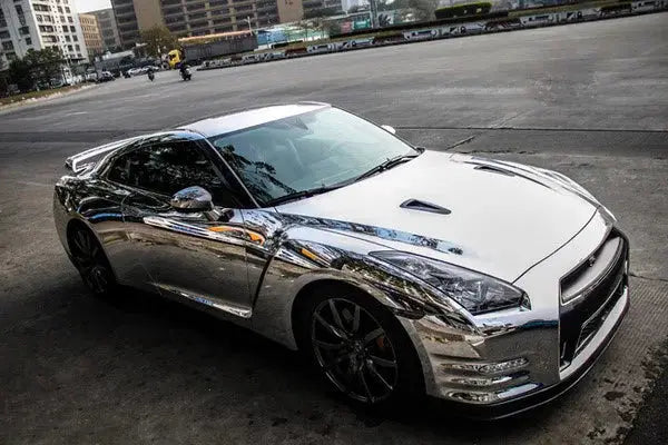 Stretchable silver chrome vinyl wrap film for cars; chrome mirror finish on a sports car