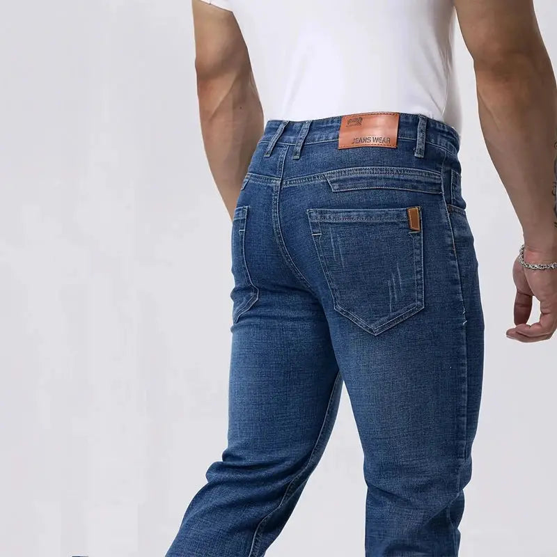Men's straight-fit blue denim jeans with stretch fabric and back pockets