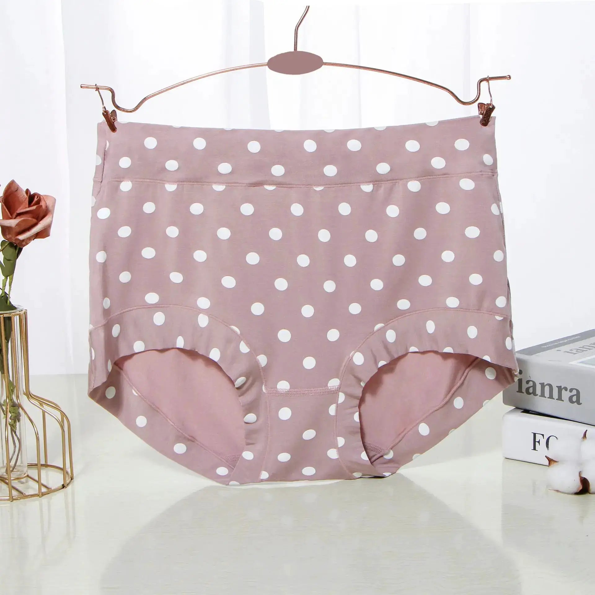 Modal large-size polka dot panties in pink with white dots, high-waist briefs on a hanger