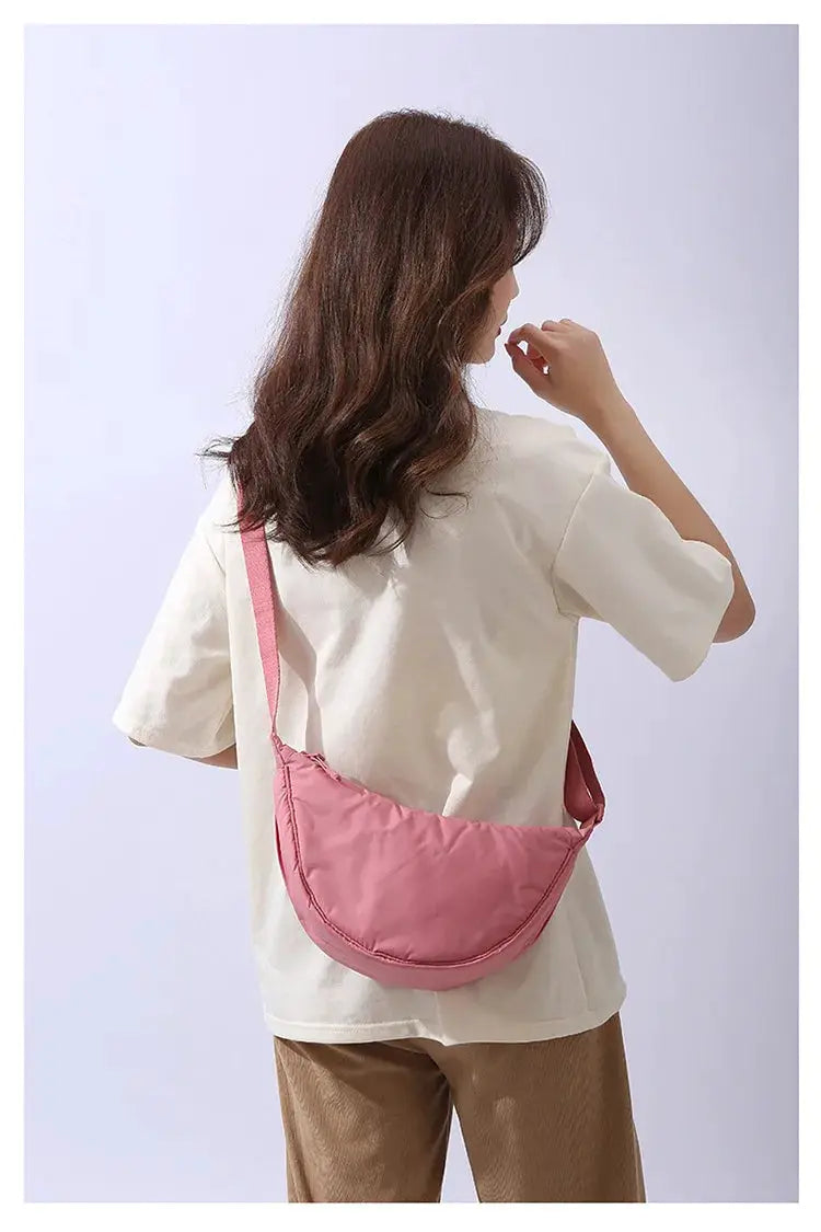 Crossbody shoulder bag with pink nylon padding by Simples Market