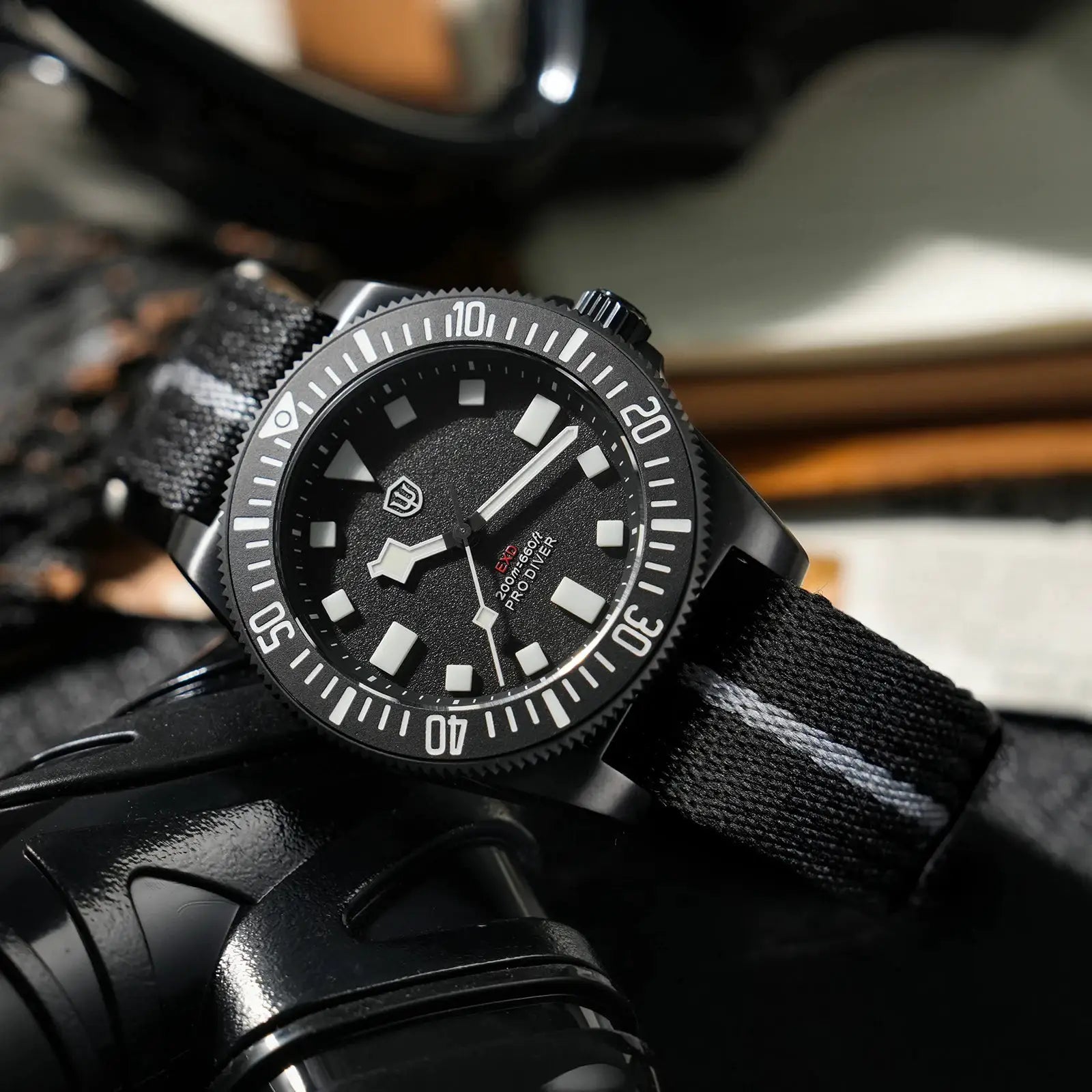 Watchdives EXD 40mm titanium dive watch with black dial, white luminous markers, and black fabric strap