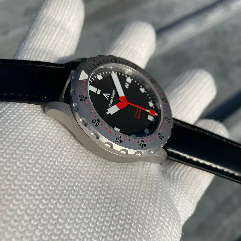 STEELFLIER SF752 dive watch with black dial and gray bezel, black strap.