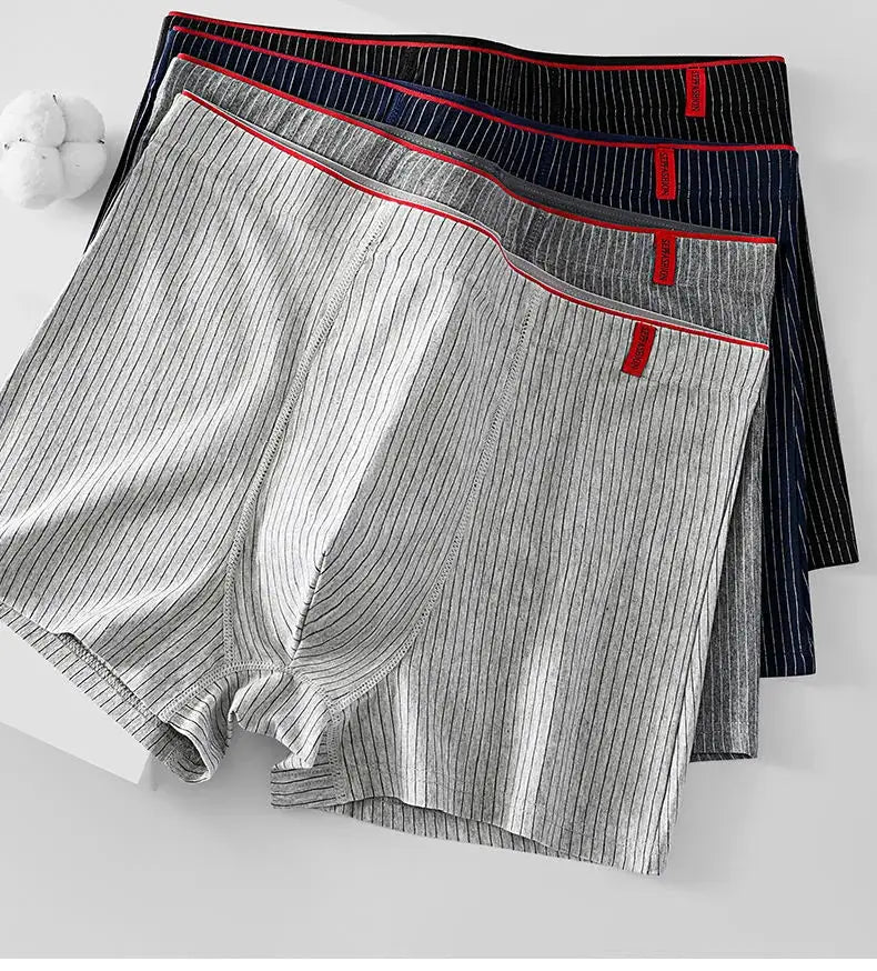 4-pack men's striped boxer underwear by Simples Market; gray, light gray, navy, and black with red branding tags